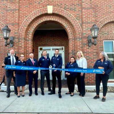 Denver team cutting the ribbon during the Grand Opening and ribbon cutting ceremony on 10/8/2025